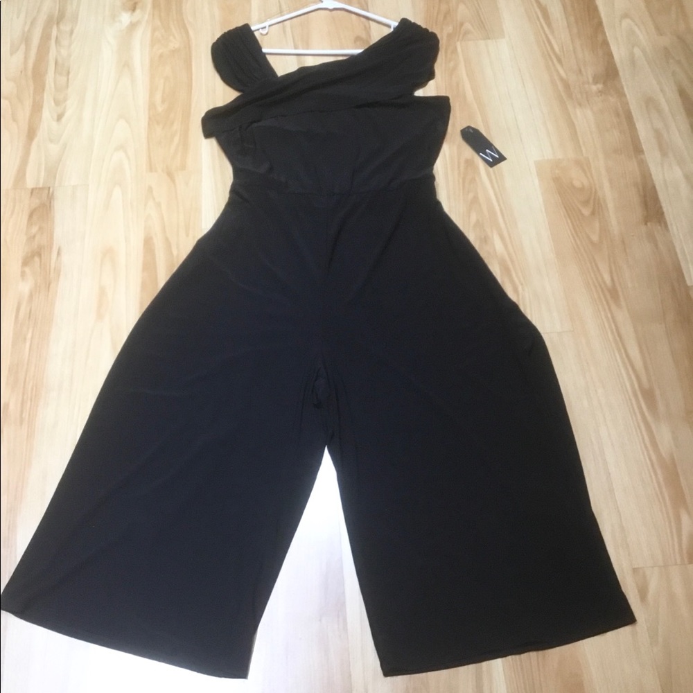Black cropped jumpsuit with tie belt waist, NWT. SIZE Large.